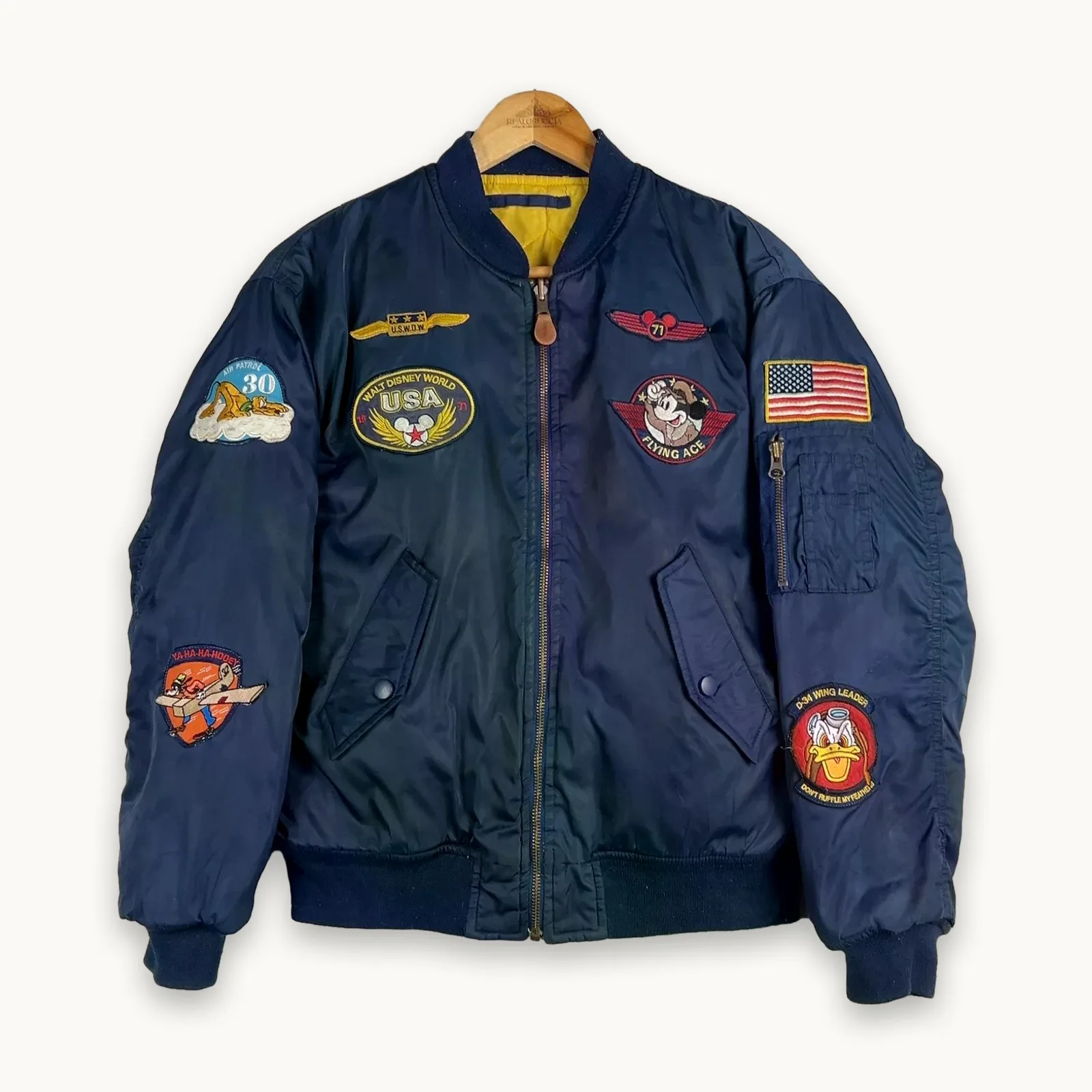 Disney — Giacca a vento con patch e zip blu